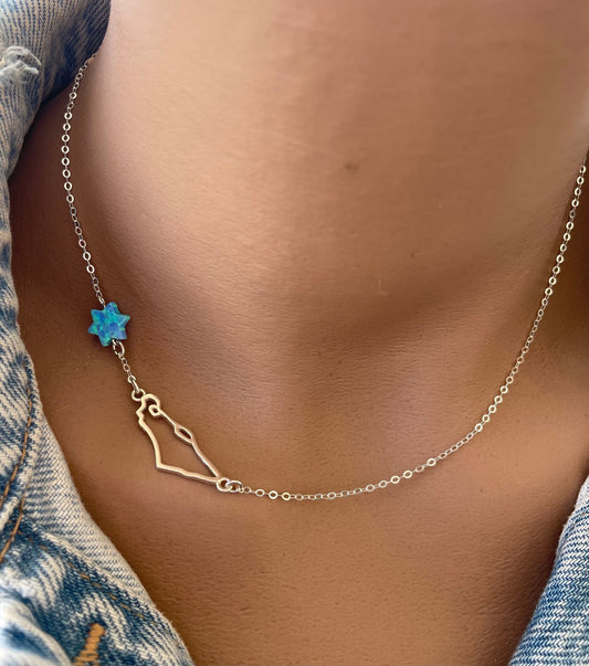 A necklace with a minimalist Israel map charm and a shimmering opal Star of David pendant on a chain.