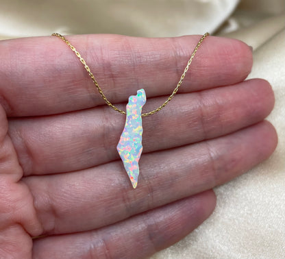 Opal stone necklace on a hand with a neutral background