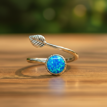 Silver open ring with a blue opal