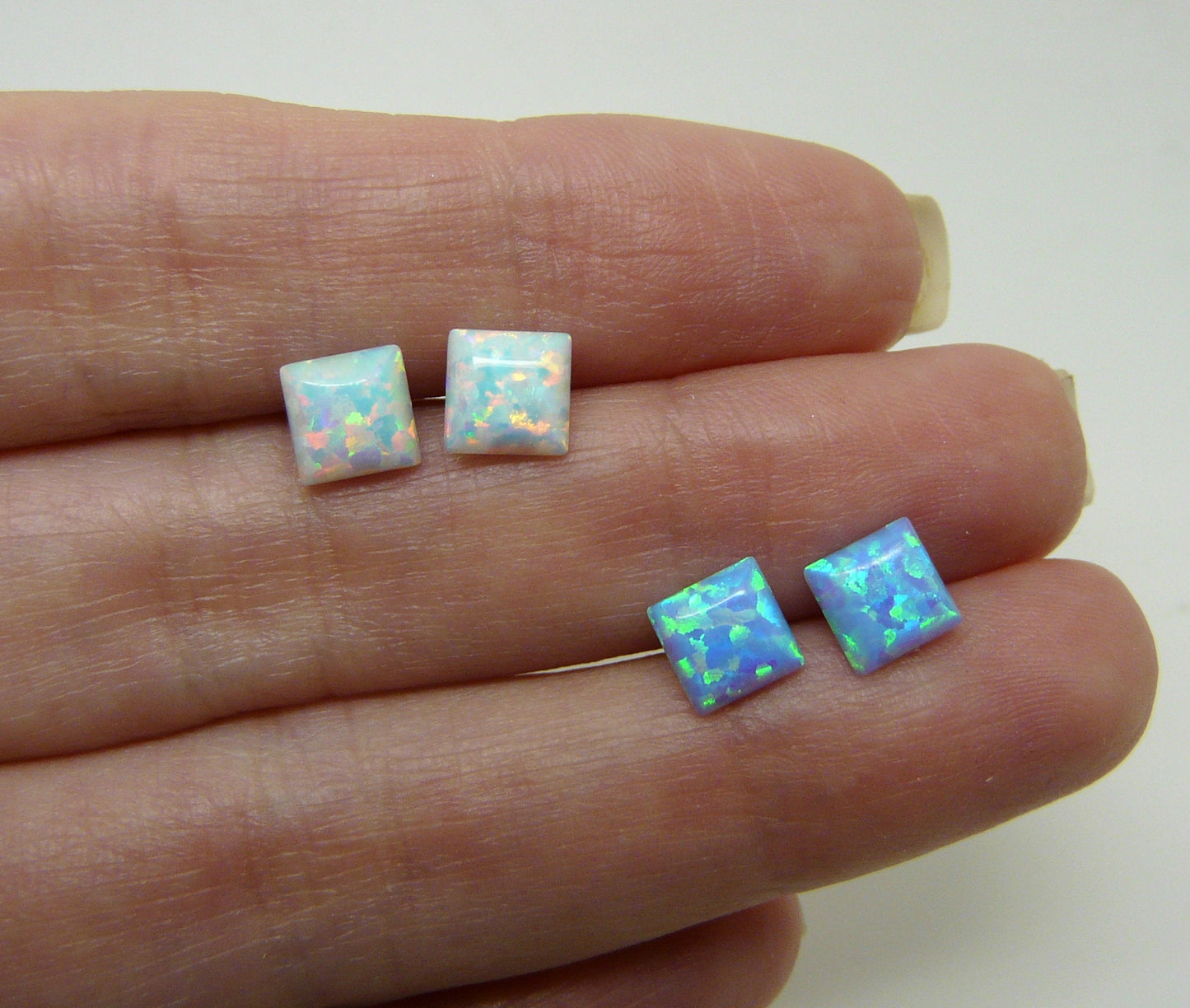 Post earrings with opal stone